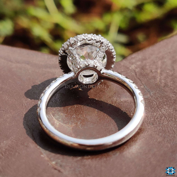 White gold engagement ring with hidden and side halo details.
