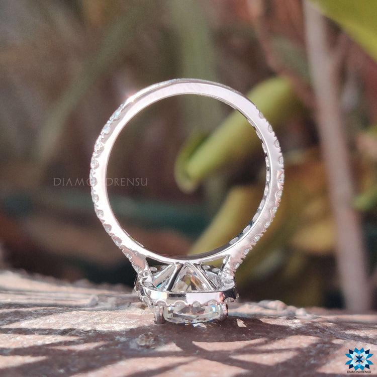 Pave engagement ring with cushion Rensu moissanite in white gold.
