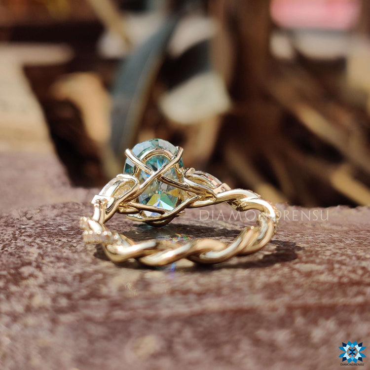 Yellow gold engagement ring with a unique twisted pave band by Diamondrensu UK.
