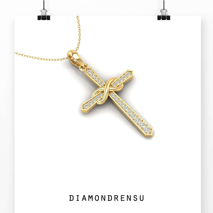 Yellow gold pendant with infinity and cross combined design.

