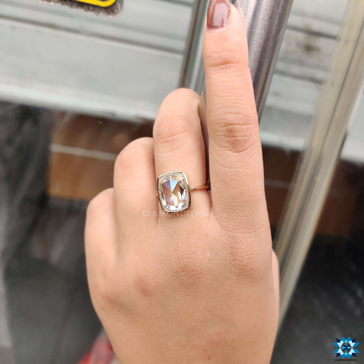 Buy moissanite ring in yellow gold bezel setting.
