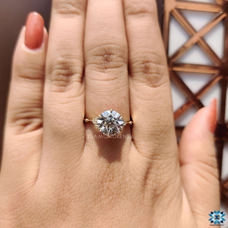 Handmade jewelry with round cut moissanite and vintage design.
