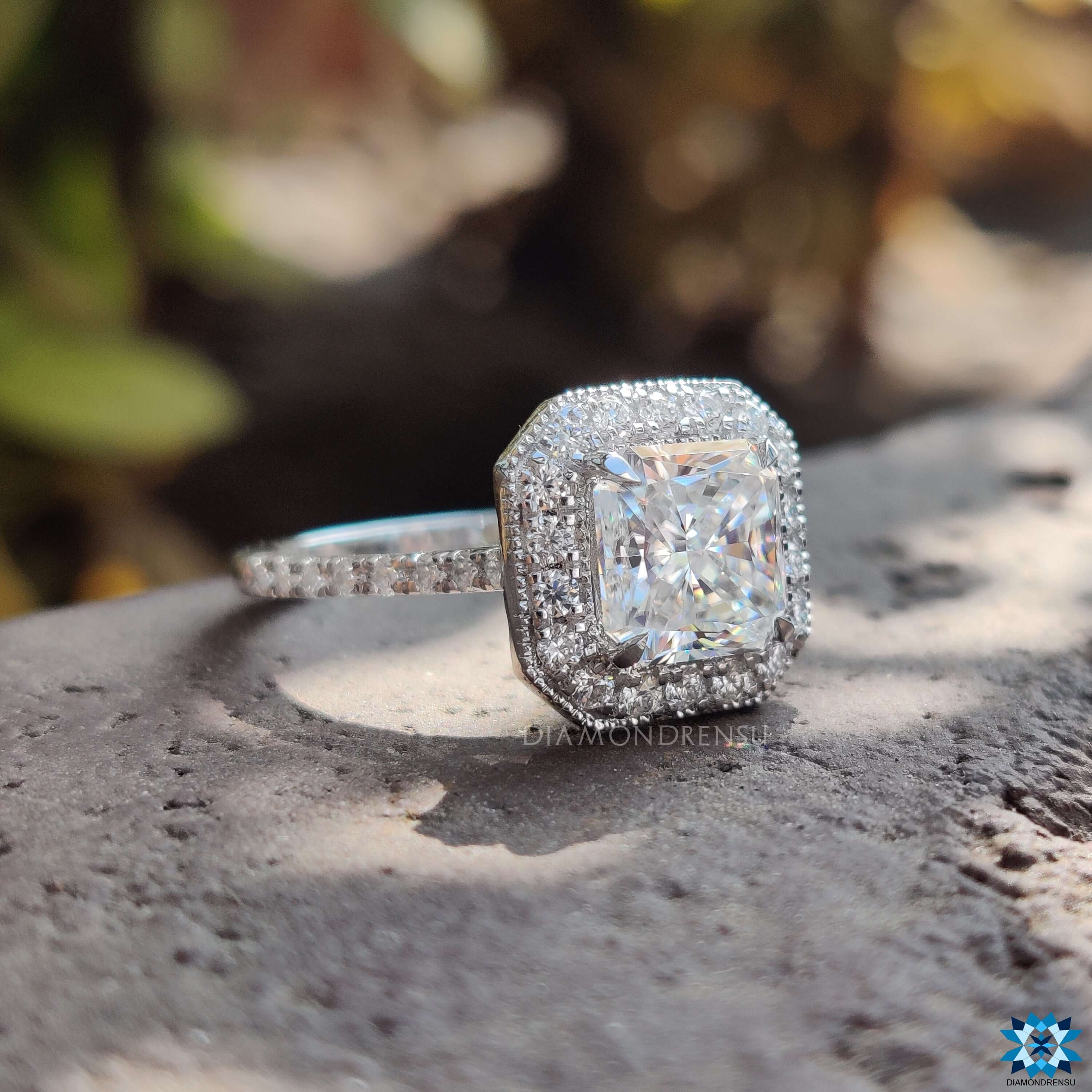 Milgrain ring featuring a radiant cut moissanite ring with intricate detailing.