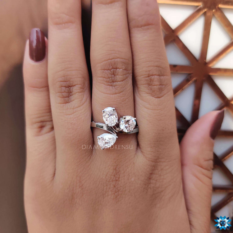 Oval, round, and pear cut moissanite in white gold.

