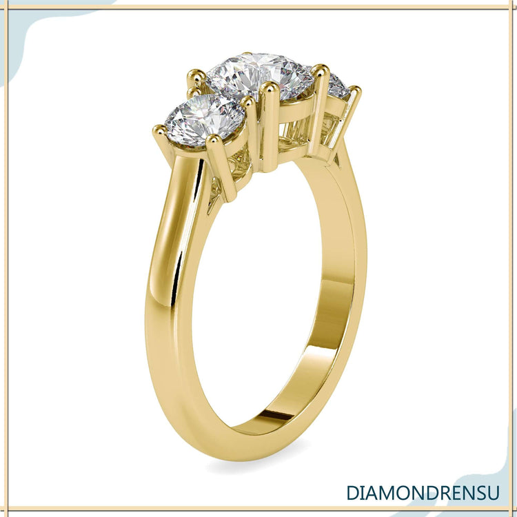 Designer ring with three stone setting and prong mount.
