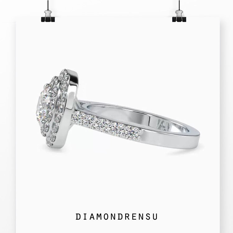 Designer ring with double halo and round diamond style.
