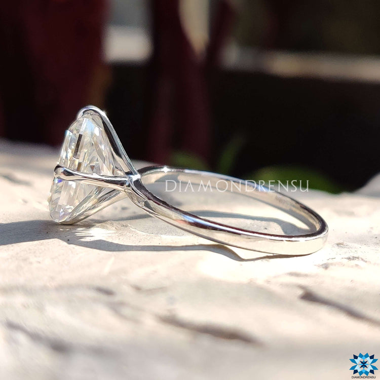 Solitaire setting white gold moissanite ring.
