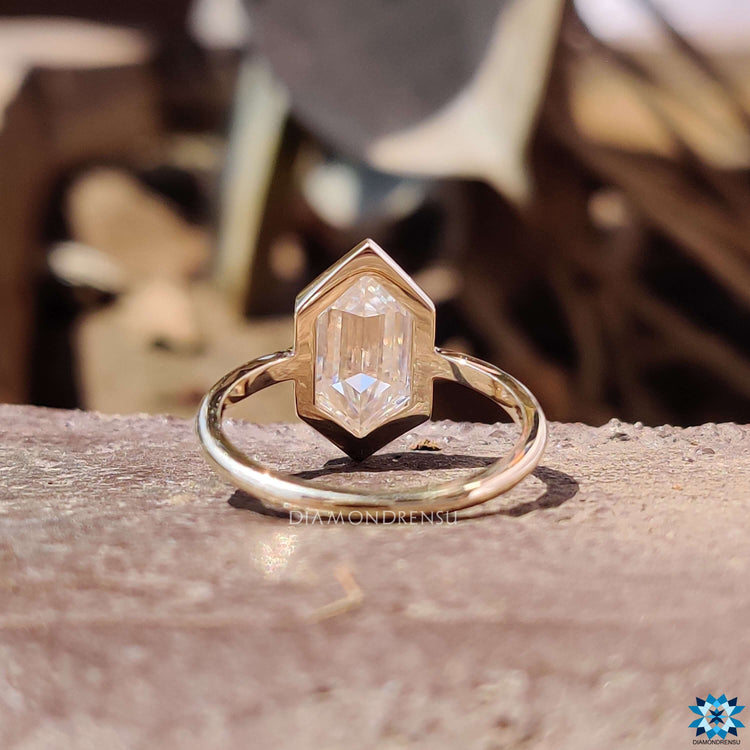 Custom moissanite ring featuring hexagon cut center stone.
