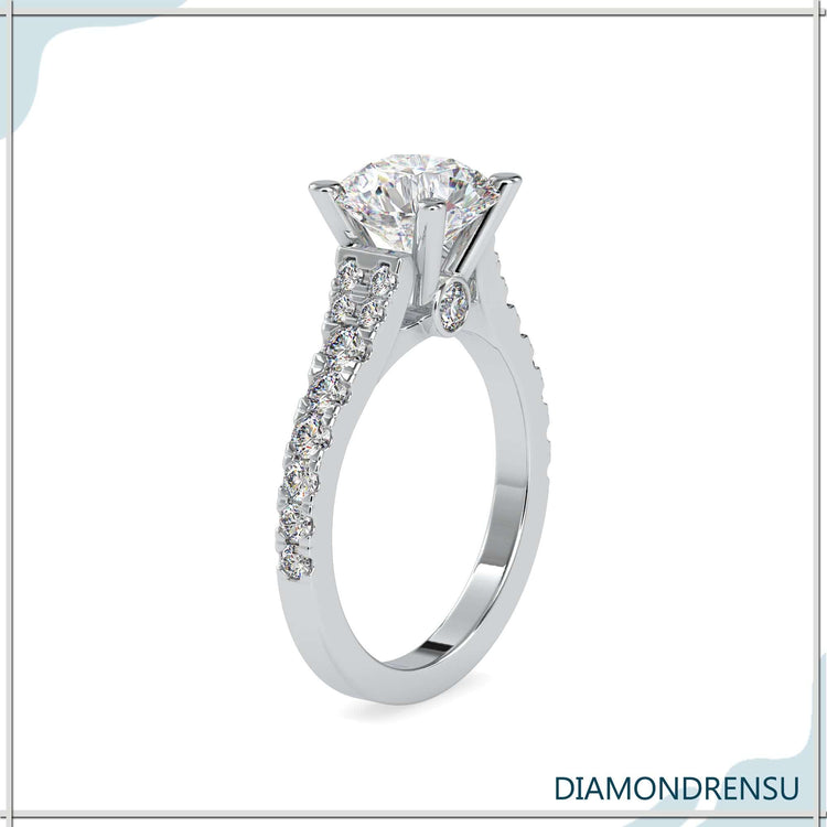 Rose gold pave engagement ring with 4 prong round diamond.
