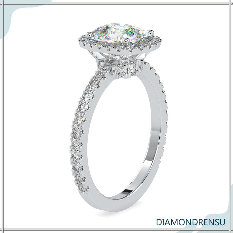 Diamondrensu UK ring with cushion centre diamond.
