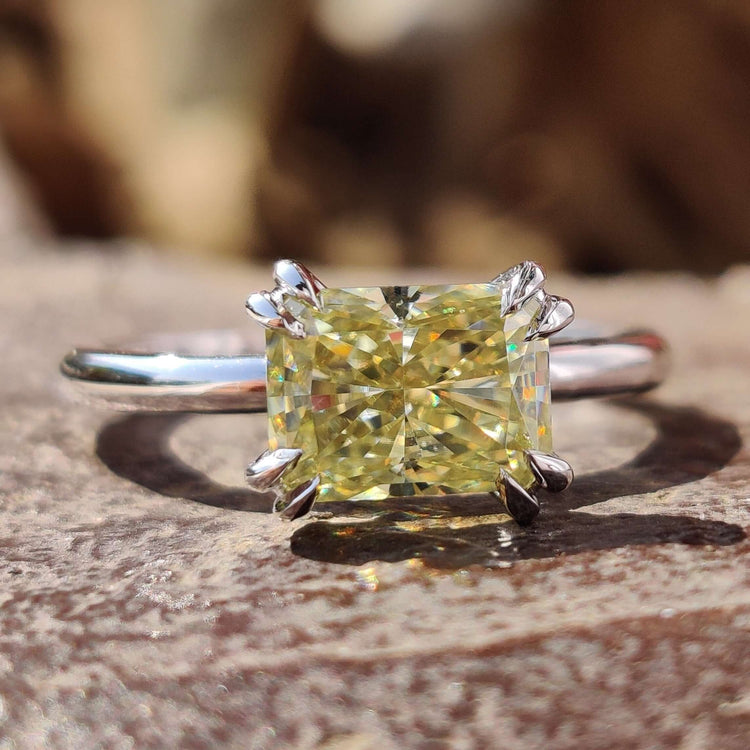East west ring with radiant cut moissanite.

