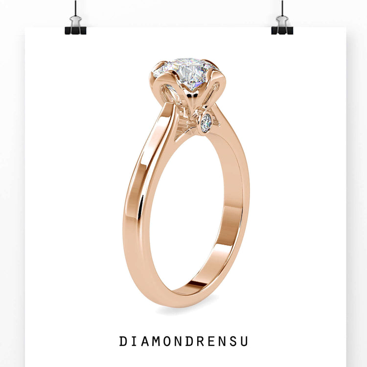 Diamondrensu UK engagement ring with round solitaire in cathedral setting.
