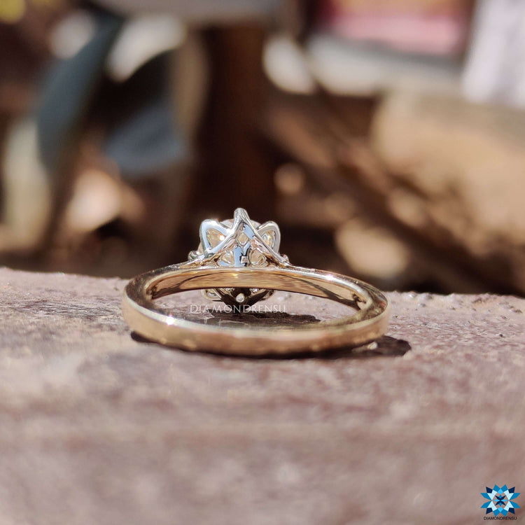 Handmade moissanite solitaire ring in yellow gold.
