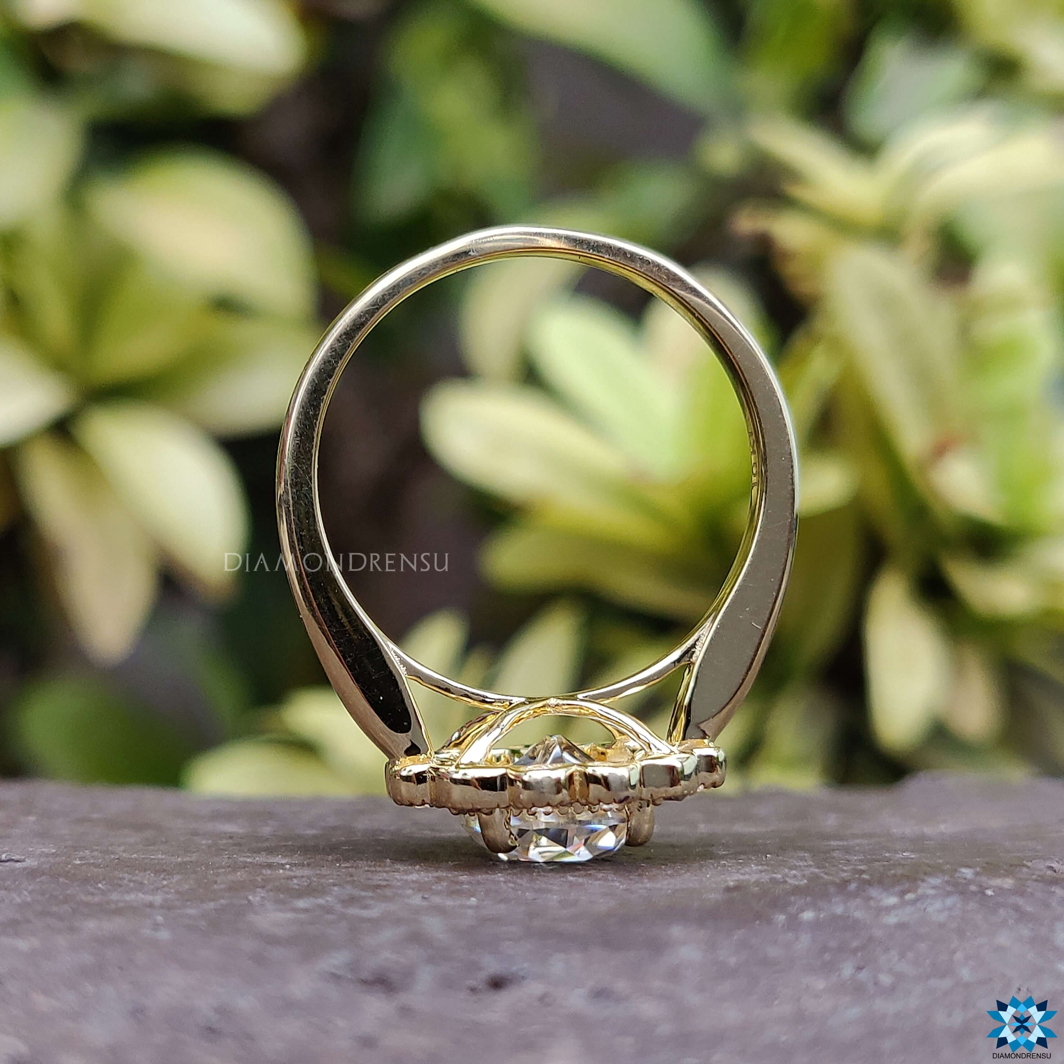 Moissanite for engagement ring set in a round brilliant cut style with a halo.