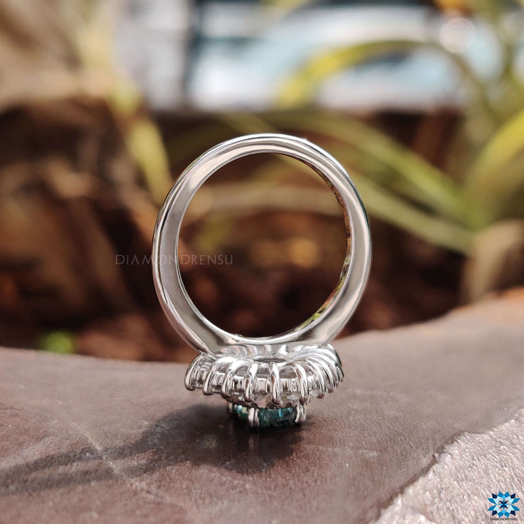 White gold moissanite ring with vintage styling.
