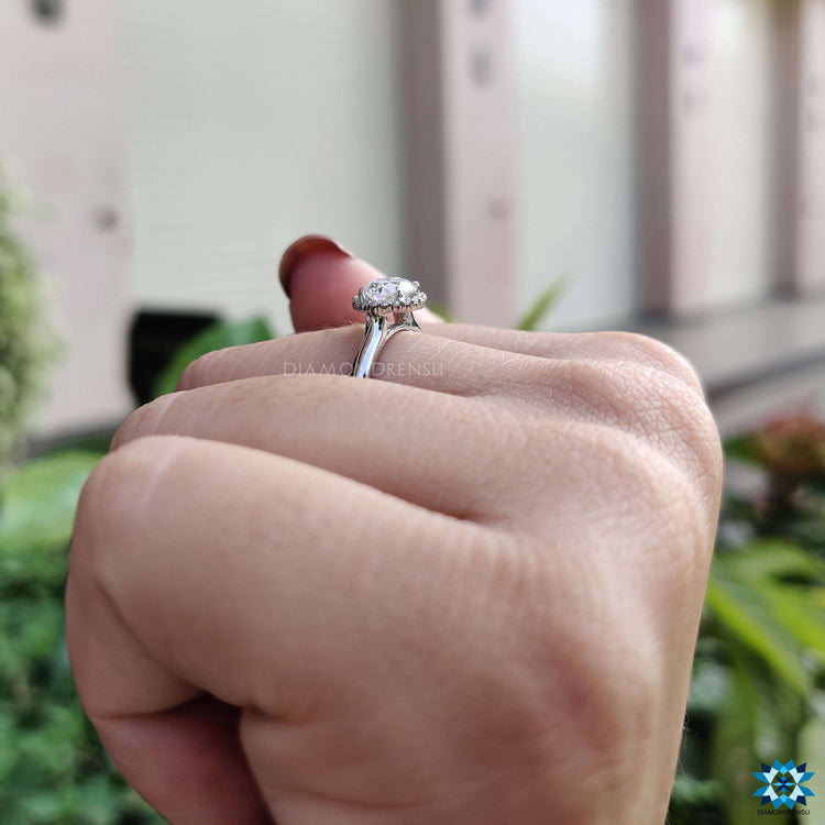 Round cut moissanite engagement ring in white gold.
