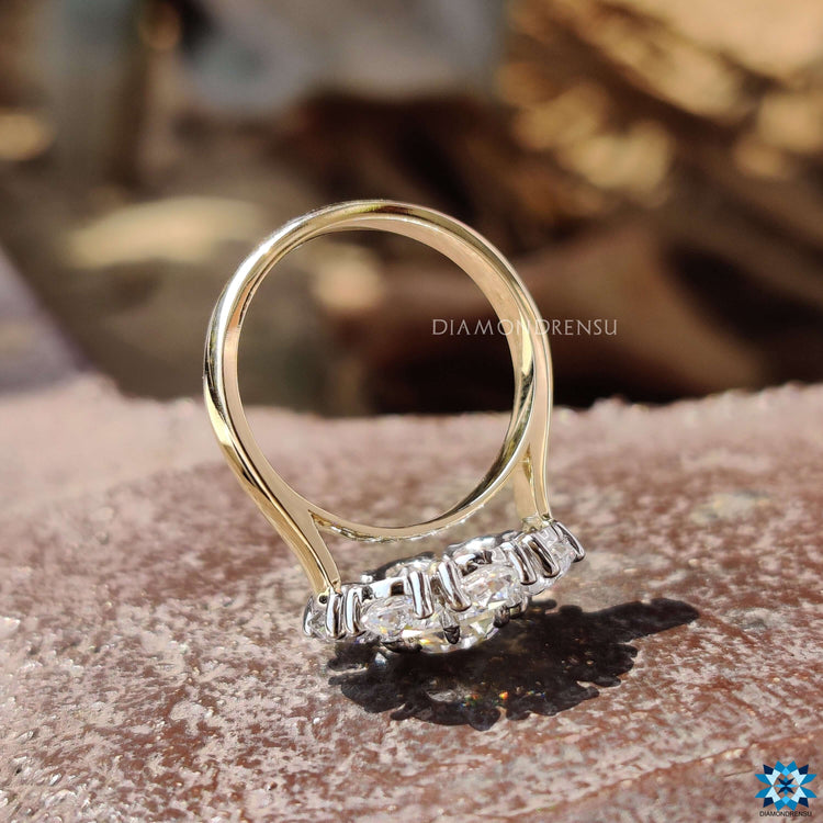Cluster halo engagement ring crafted in white and yellow gold.
