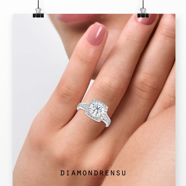 Round diamond ring with split shank and prong setting.
