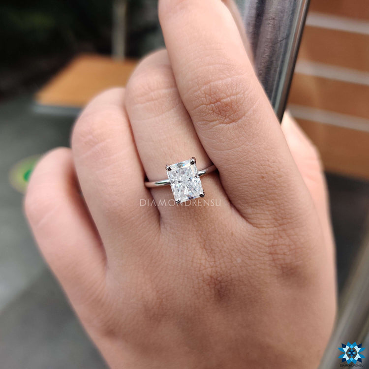 Handmade jewellery featuring white gold and radiant cut moissanite.

