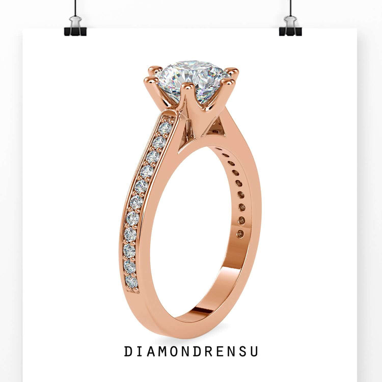 Custom engagement ring in yellow gold with channel set stones.
