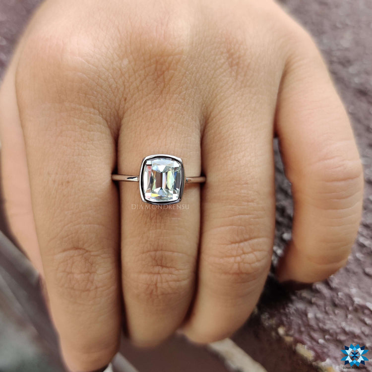 White gold engagement ring with old European cut cushion stone.
