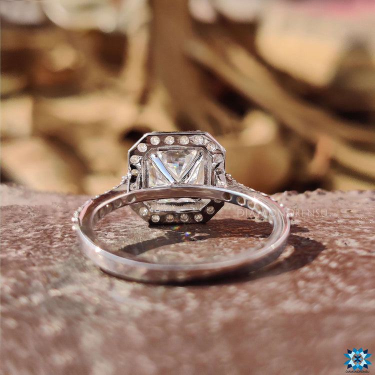 White gold moissanite ring with 4 prong setting.
