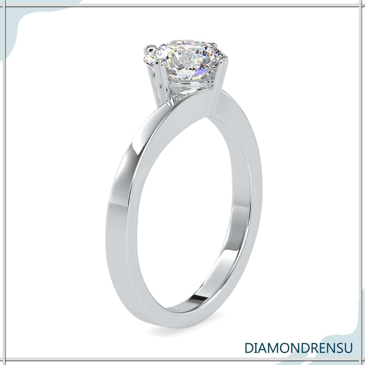 Buy engagement ring in UK with bypass solitaire style.
