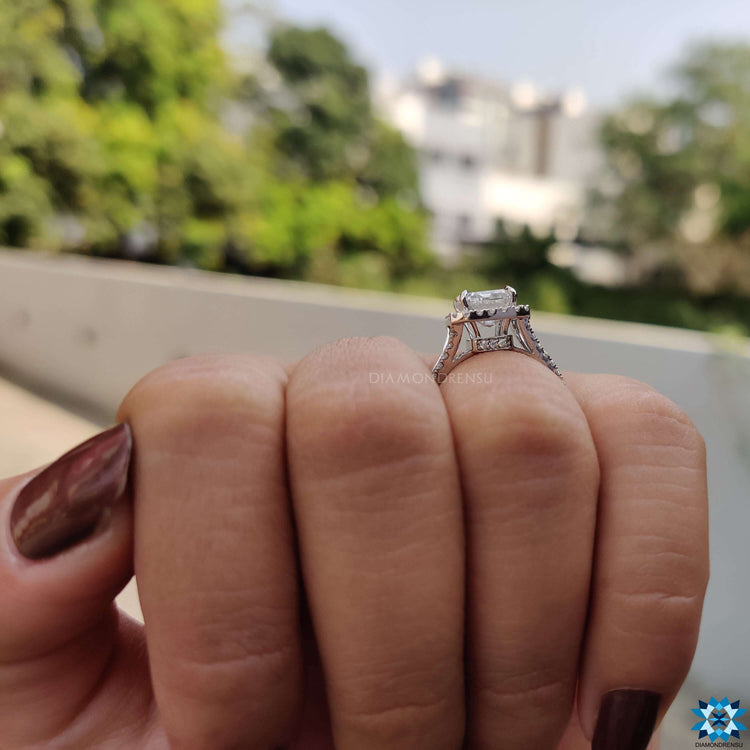 4 prong emerald cut moissanite ring in white gold.
