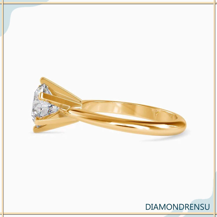 White gold engagement ring with round cut solitaire diamond.
