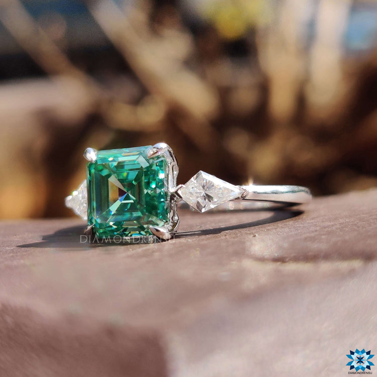 White gold ring featuring Asscher cut moissanite.
