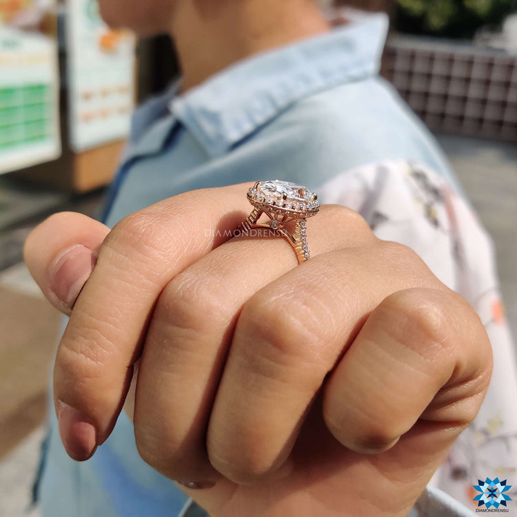 Handmade moissanite engagement ring with halo design.
