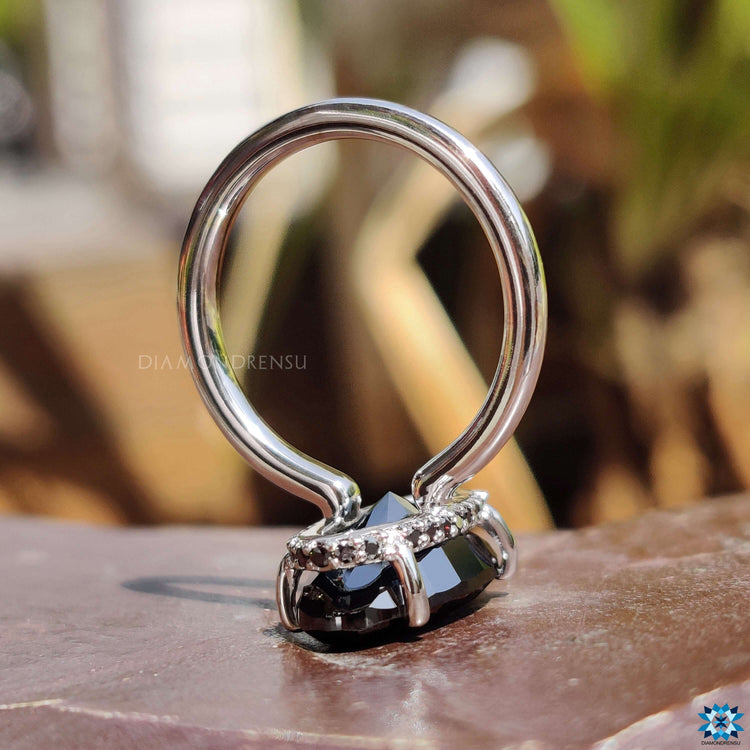 Solitaire setting ring with moval cut moissanite.
