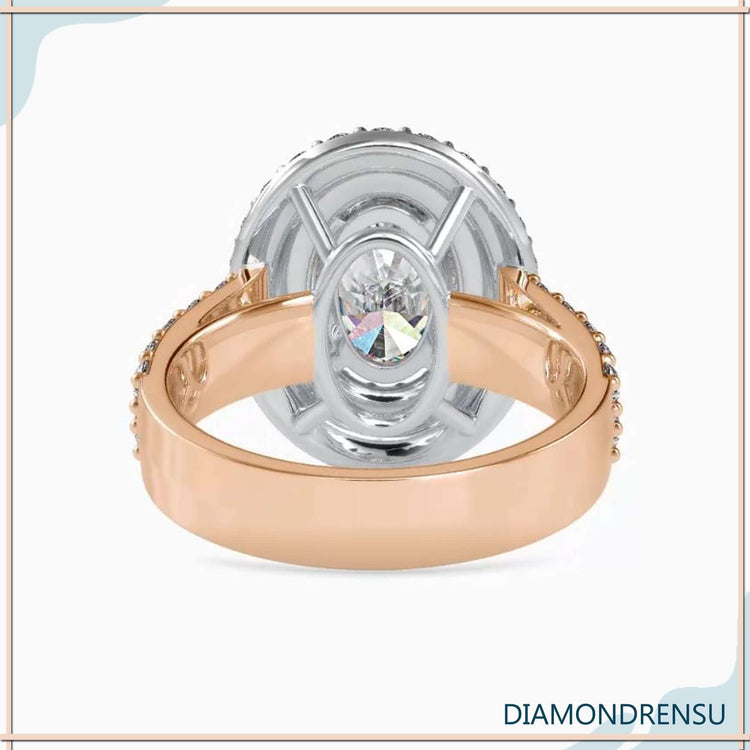 White gold double halo ring with oval cut lab diamond.
