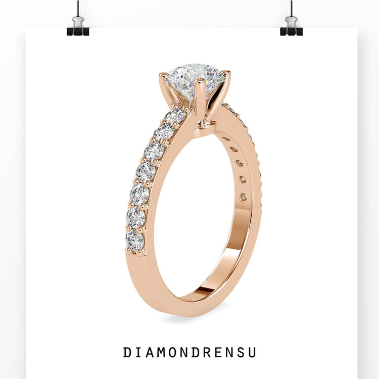 Rose gold ring featuring round cut diamond and pave band.
