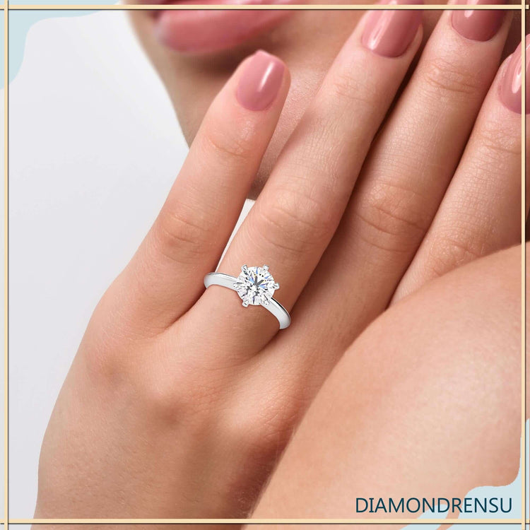 White gold round cut solitaire diamond ring.
