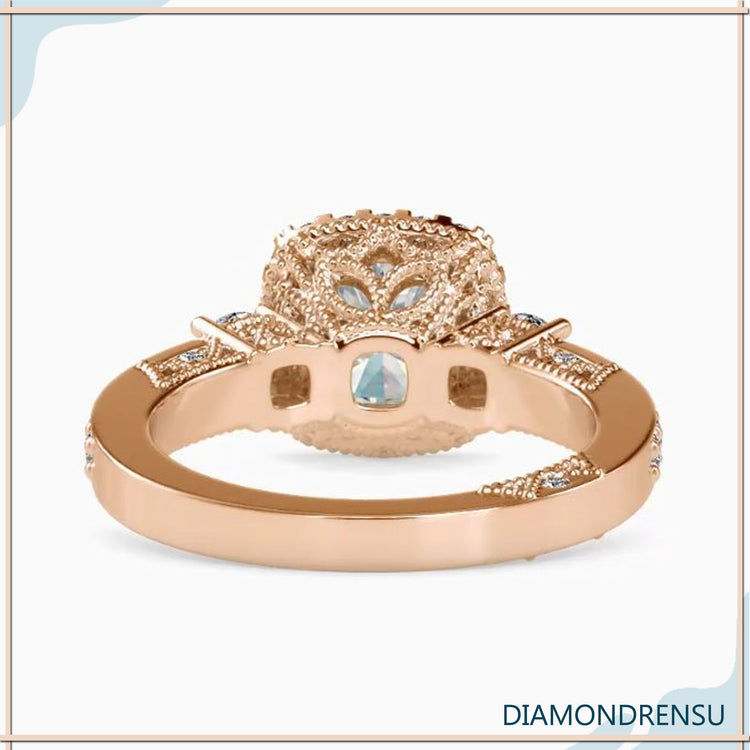Handmade jewellery ring with halo and side diamonds.

