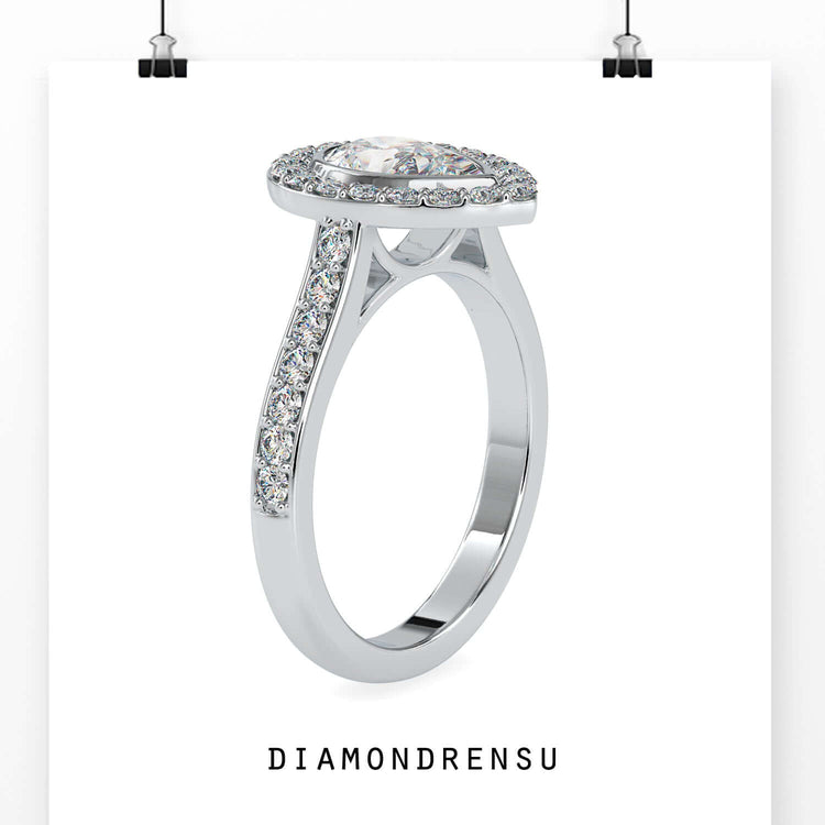 IGI certified engagement ring with bezel set pear shape.
