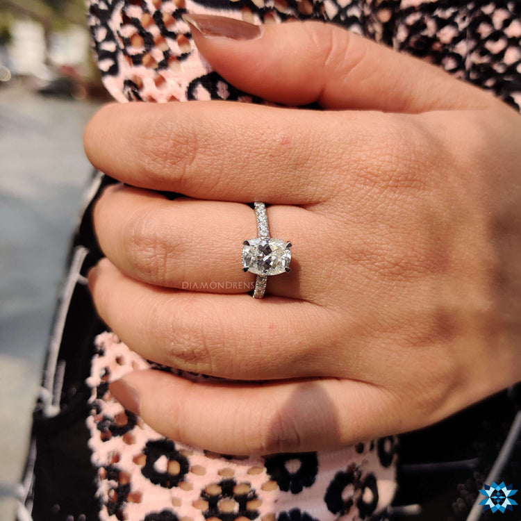 Handmade moissanite engagement ring with pave band.
