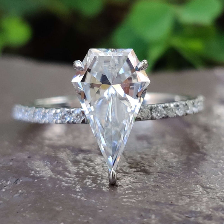 Spear cut moissanite engagement ring in white gold.
