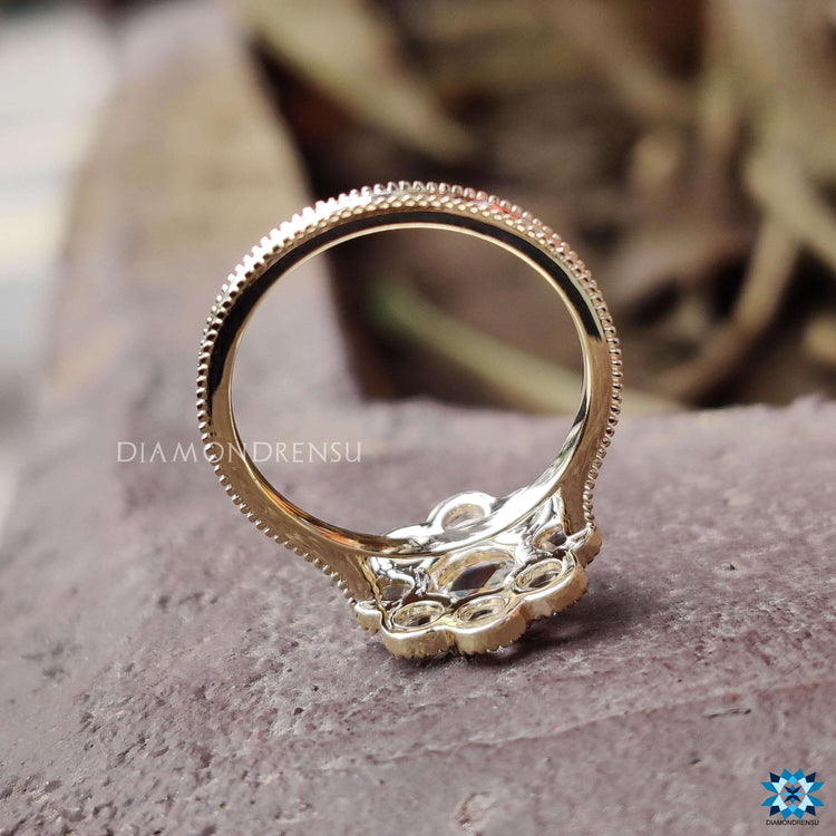 Custom yellow gold ring with round rose cut moissanite.

