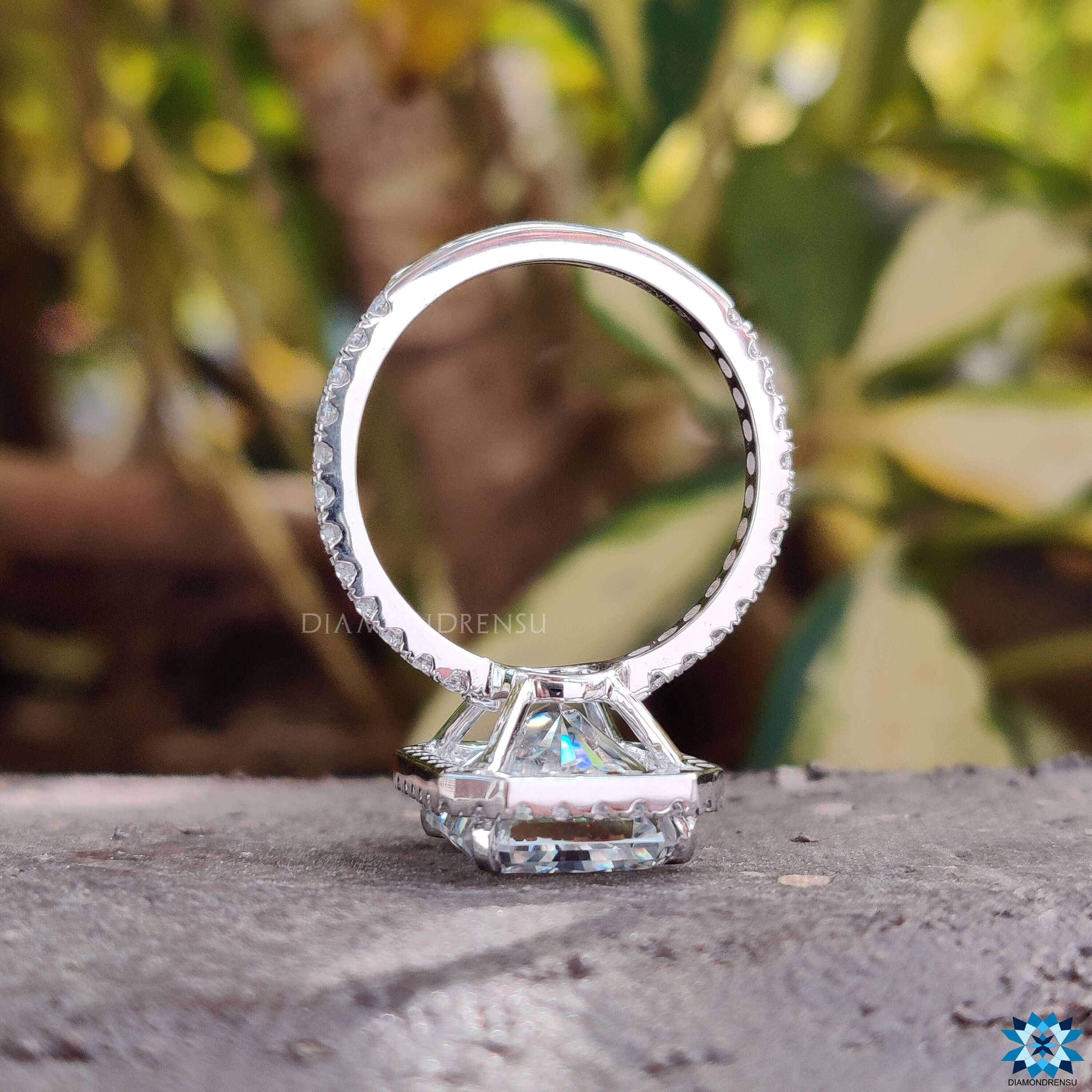 Moissanite halo ring in white gold.