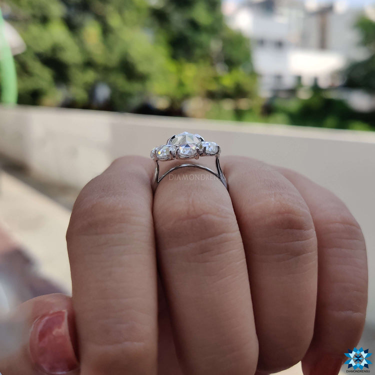 Moissanite halo ring with oval rose cut center stone.
