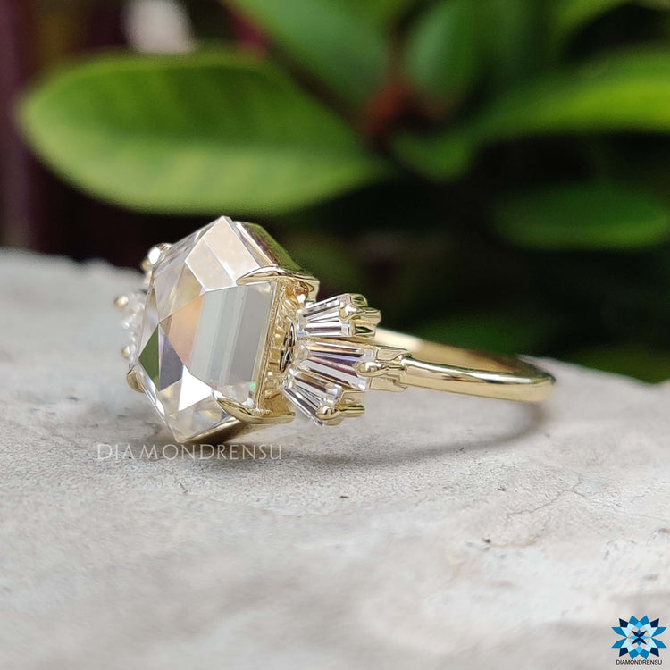 Handmade hexagon engagement ring with side baguette diamonds.
