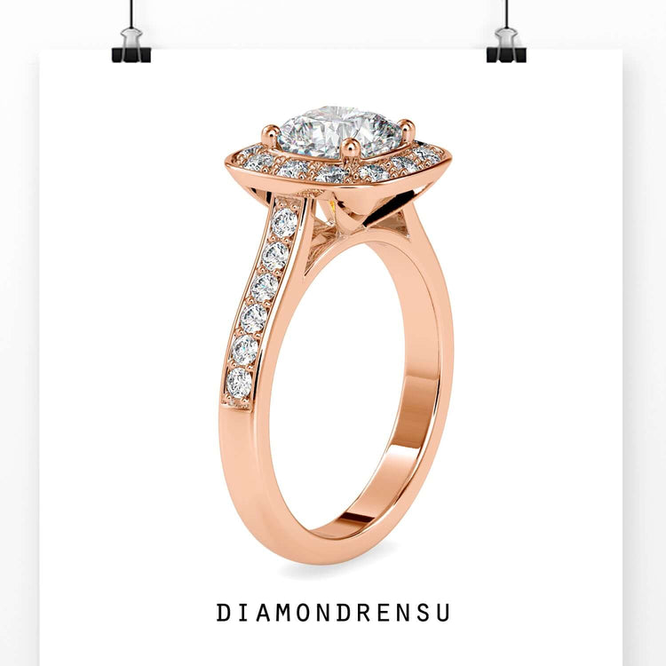 Halo engagement ring with round cut pave band in yellow gold.
