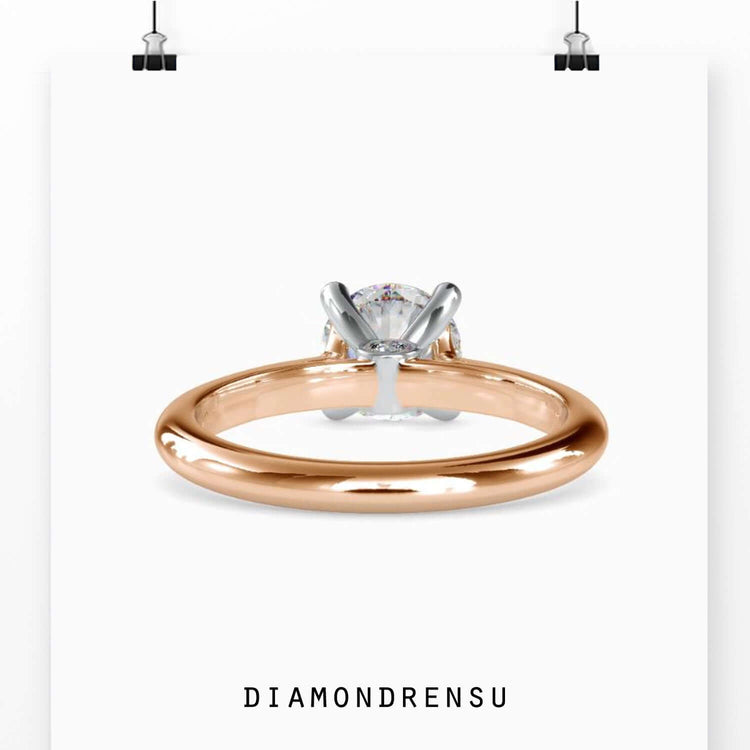 Simple diamond ring with white gold solitaire mount.
