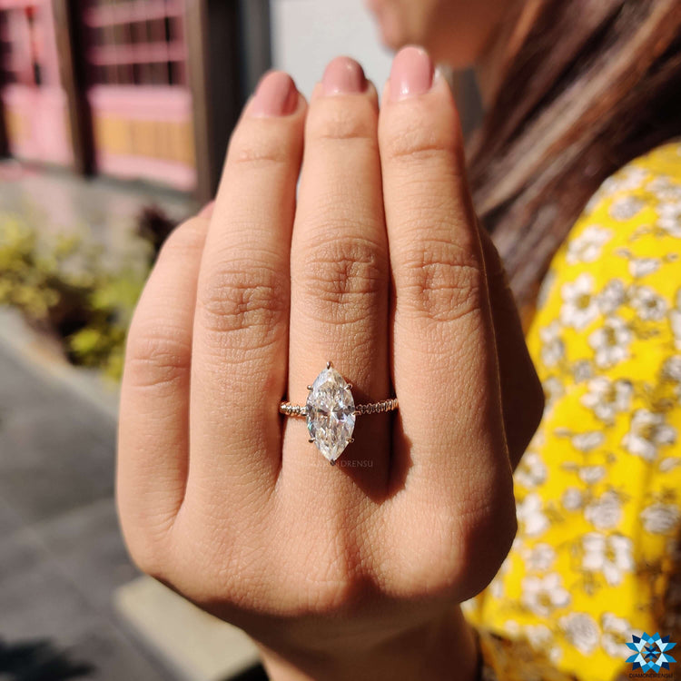 Custom engagement ring with marquise moissanite.

