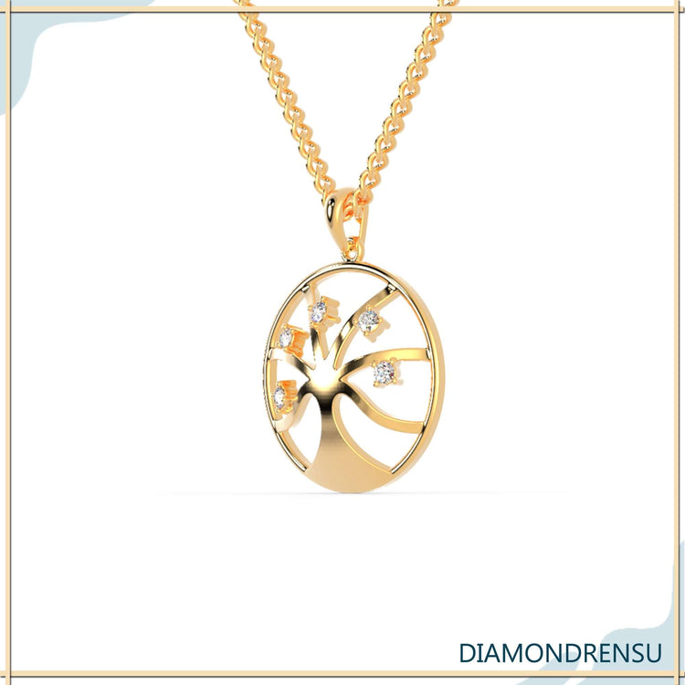 UK diamond pendant with tree of life charm in elegant finish.
