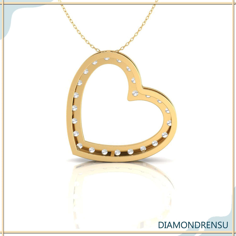 Handmade gold heart pendant with lab grown diamond.
