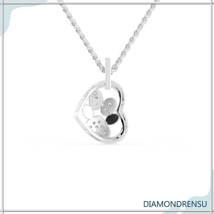 White gold pendant with heart and round diamond centre.

