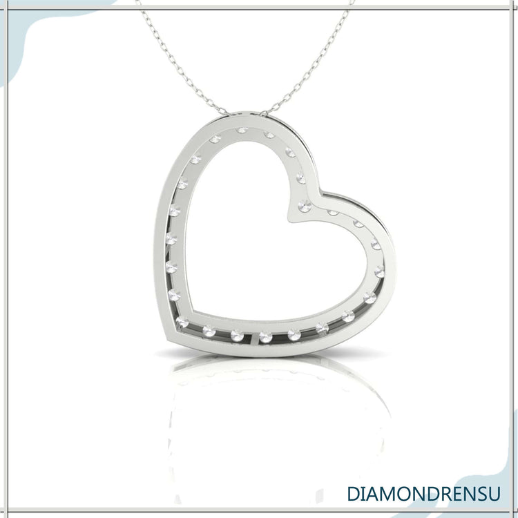 Gold diamond pendant with prong set heart-shaped centre.

